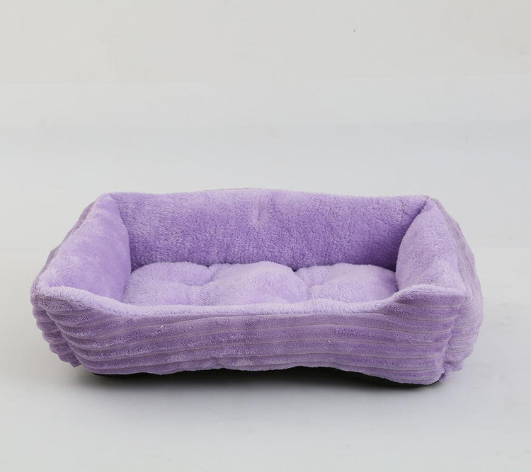 Soft and cozy rectangular pet bed with a purple exterior and interior, offering comfort for small pets.