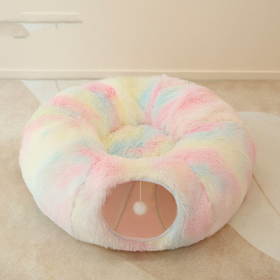 Soft and fluffy pet bed with an enclosed tunnel design, perfect for cats and small dogs seeking a warm and snug resting spot